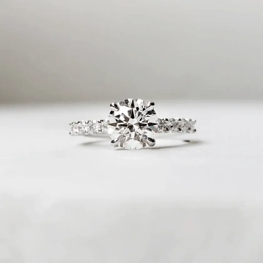 round brilliant solitaire diamond engagement ring with sharp prongs